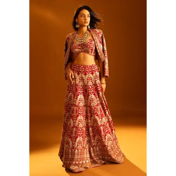 SEASONS-RED CLASSIC BRIDAL LEHENGA SET WITH ALL OVER PATTERNED THREAD WORK PAIRED WITH A MATCHING CROPPED JACKET AND SEQUIN DETAILS.