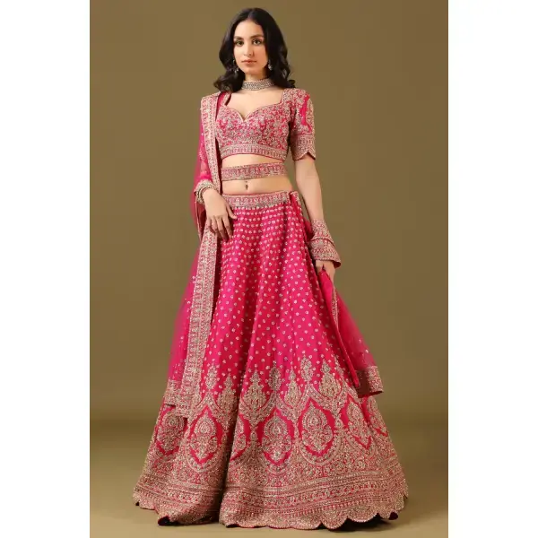 SEASONS-RANI PINK CLASSIC BRIDAL LEHENGA SET WITH ALL OVER PATTERNED HAND EMBROIDERY PAIRED WITH A MATCHING DUPATTA AND FLORAL EMBROIDERED DETAILS.