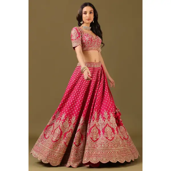 SEASONS-RANI PINK CLASSIC BRIDAL LEHENGA SET WITH ALL OVER PATTERNED HAND EMBROIDERY PAIRED WITH A MATCHING DUPATTA AND FLORAL EMBROIDERED DETAILS.